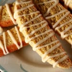 Several lemon poppy seed biscotti on a plate.