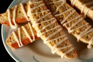 Several lemon poppy seed biscotti on a plate.