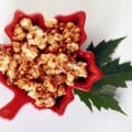 A maple leaf shaped bowl of maple popcorn.