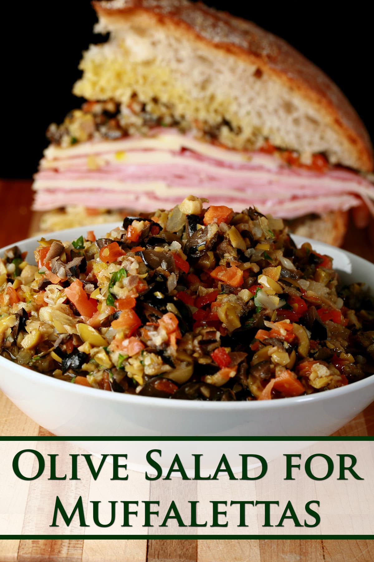 A bowl of olive salad in front of a wedge of muffaletta.