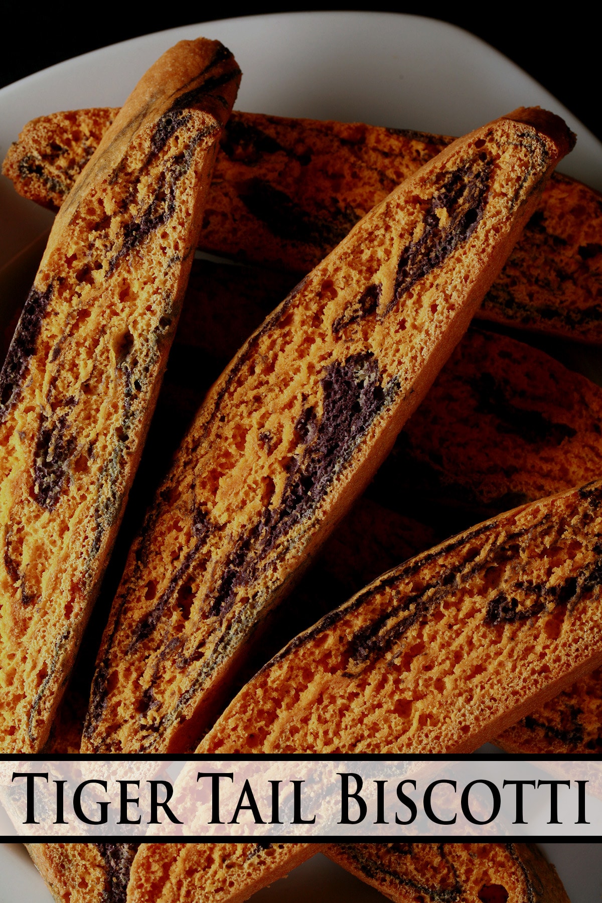 A plate of tiger tail biscotti: Orange and anise, marbled.