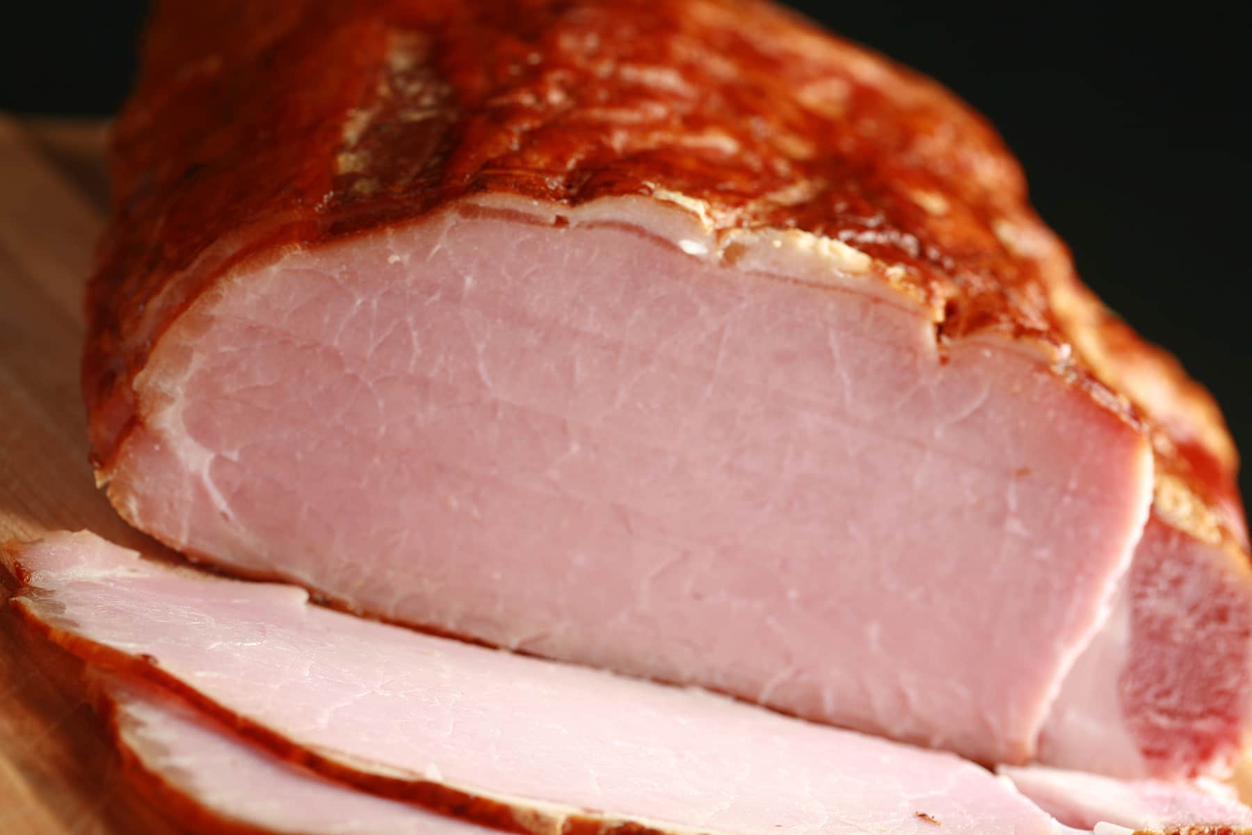 A sliced loin of smoked back bacon.