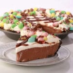 An Easter no bake chocolate pie with whipped cream and Cadbury Mini Eggs.