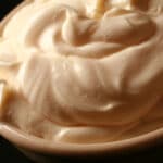 A close up view of a bowl of cold smoked mayonnaise.