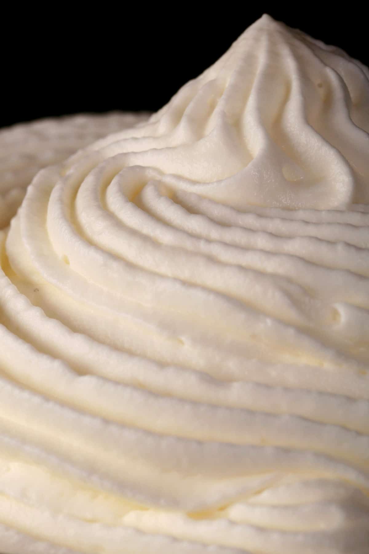 A bowl of piped stabilized whipped cream.