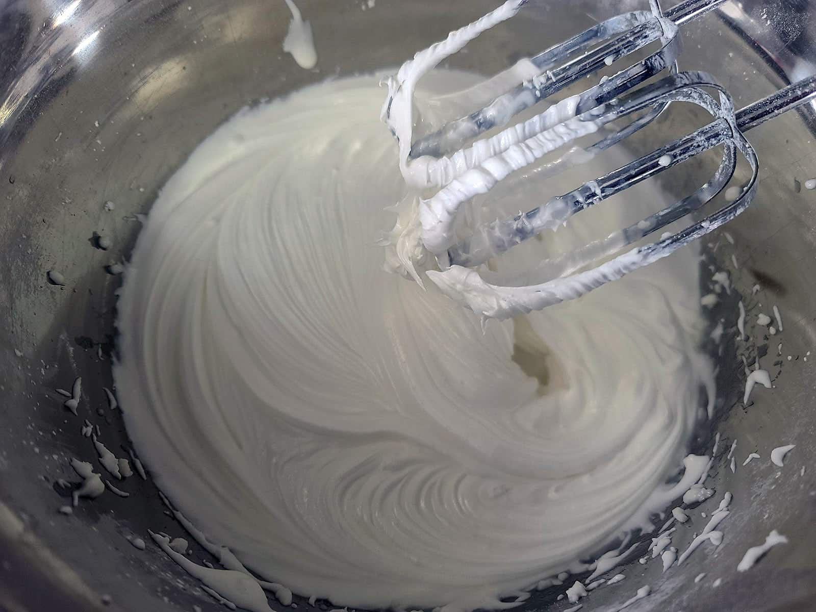 A bowl of stiff meringue powder royal icing.