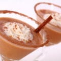 2 Pumpkin Pie Martinis with spiced sugar rim and whipped cream.