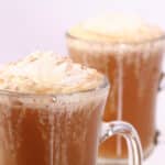 2 homemade pumpkin spice latte drinks, topped with whipped cream and nutmeg.