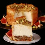A slice of baklava cheesecake, in front of the rest of the mini cheesecake.