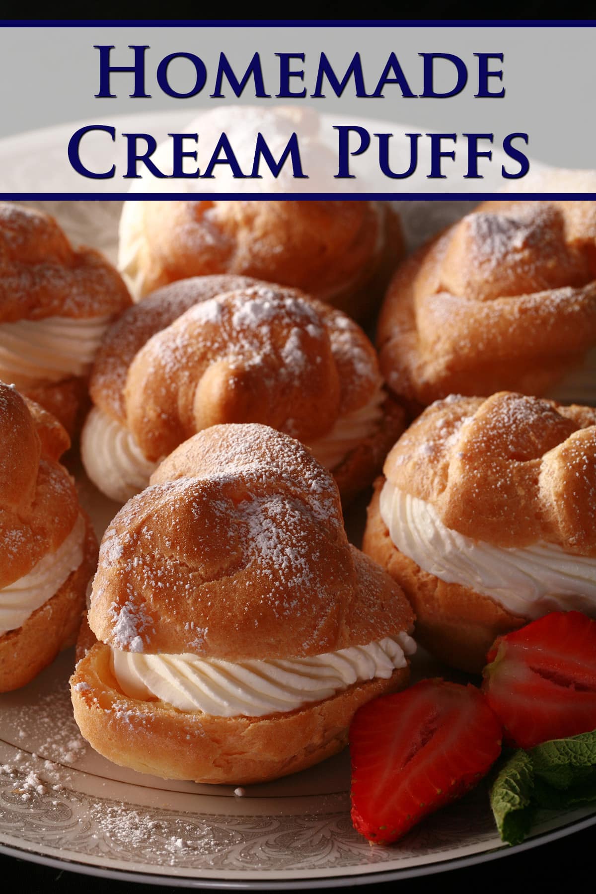 A large plate of cream puffs. They’re dusted with powdered sugar.