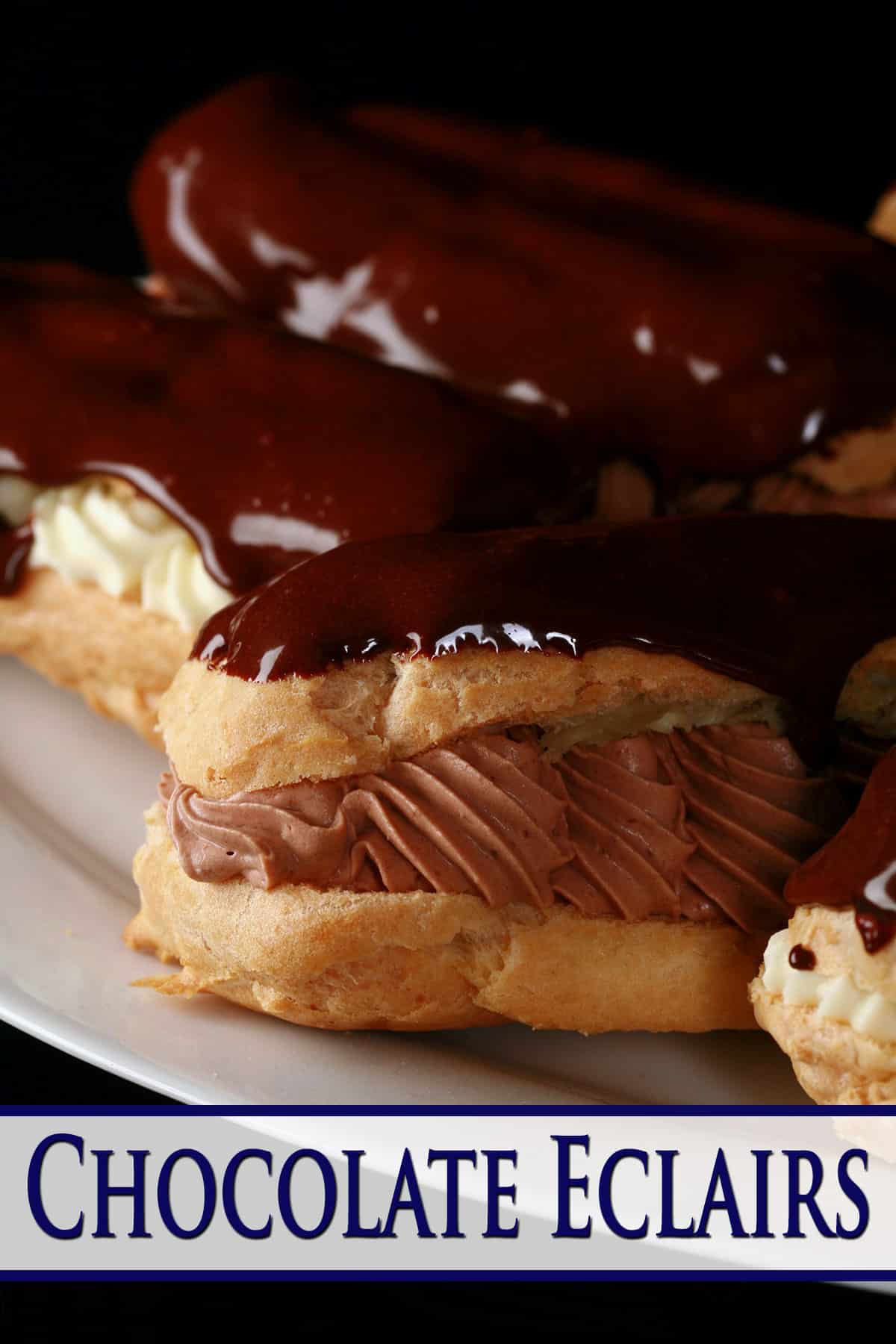 Several chocolate eclairs on a plate, with chocolate and vanilla cream fillings.