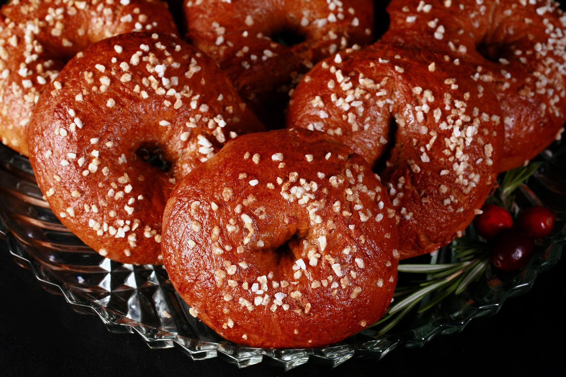 A plate of sugar crusted homemade gingerbread bagels.