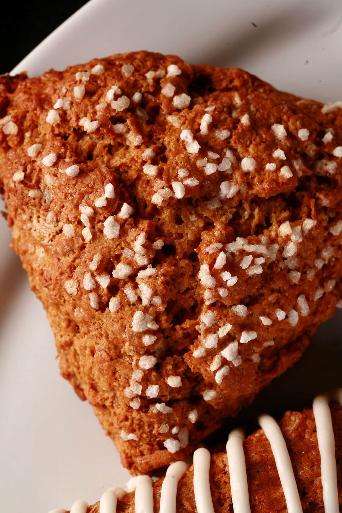 A close up view of a sugar topped gingerbread scone.