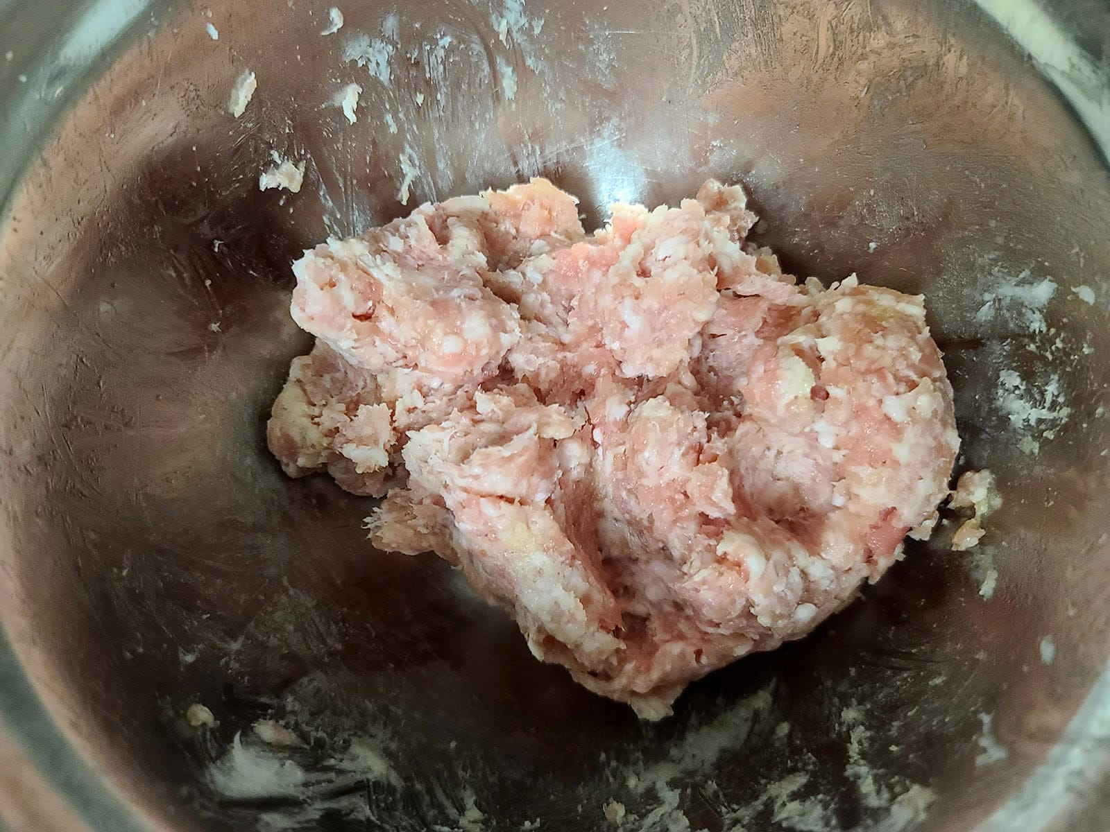 A bowl of homemade ground pork sausage meat.