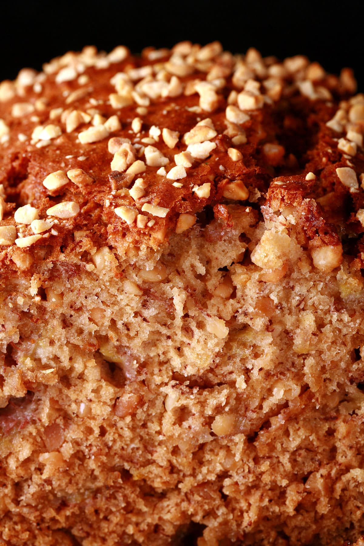 A close up photo of a loaf of peanut butter banana bread.