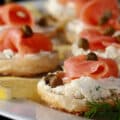 A platter of mini bagel smoked salmon canapes.