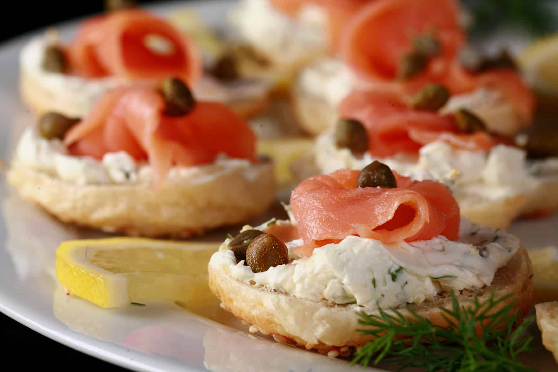 A platter of mini bagel smoked salmon canapes.