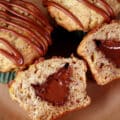 2 whole Banana nutella muffins and a split open 3 muffin, showing the Nutella filling inside.