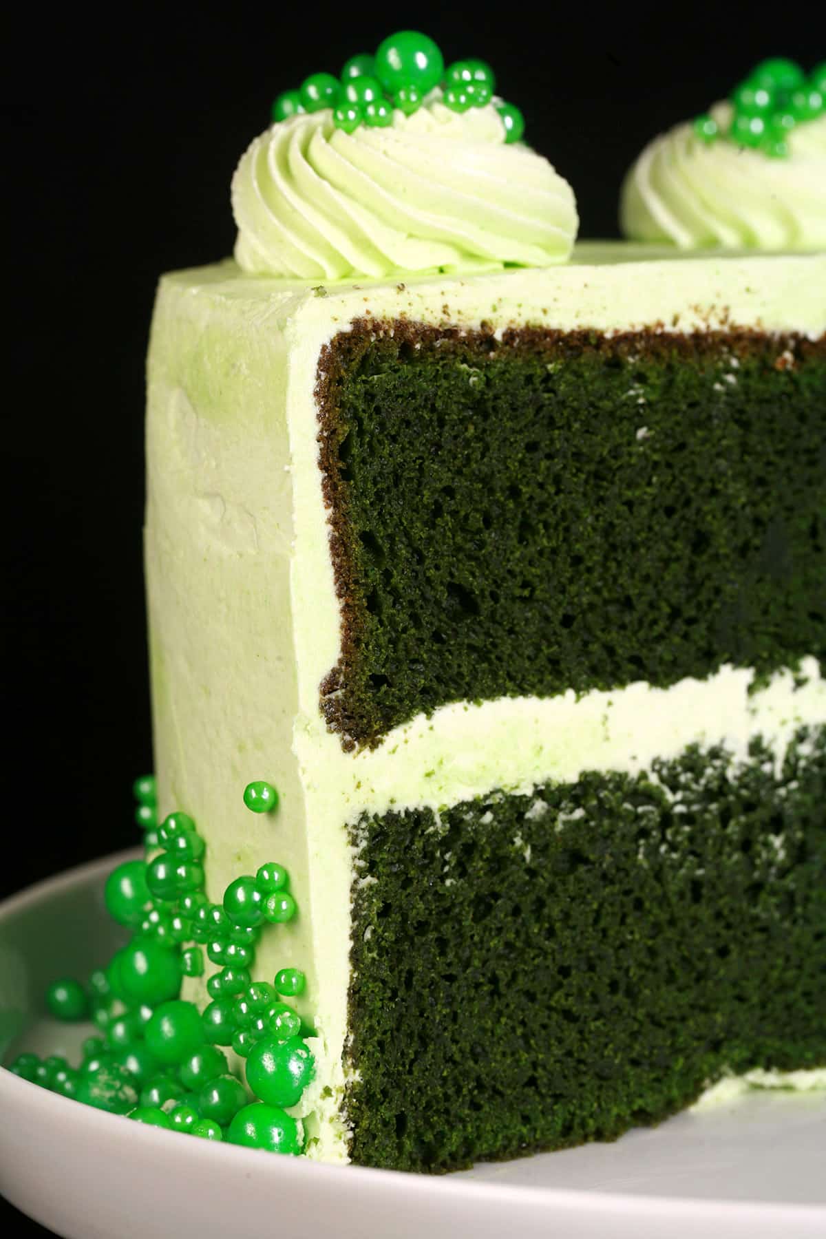 A close up photo of a green velvet St Patrick's Day cake.