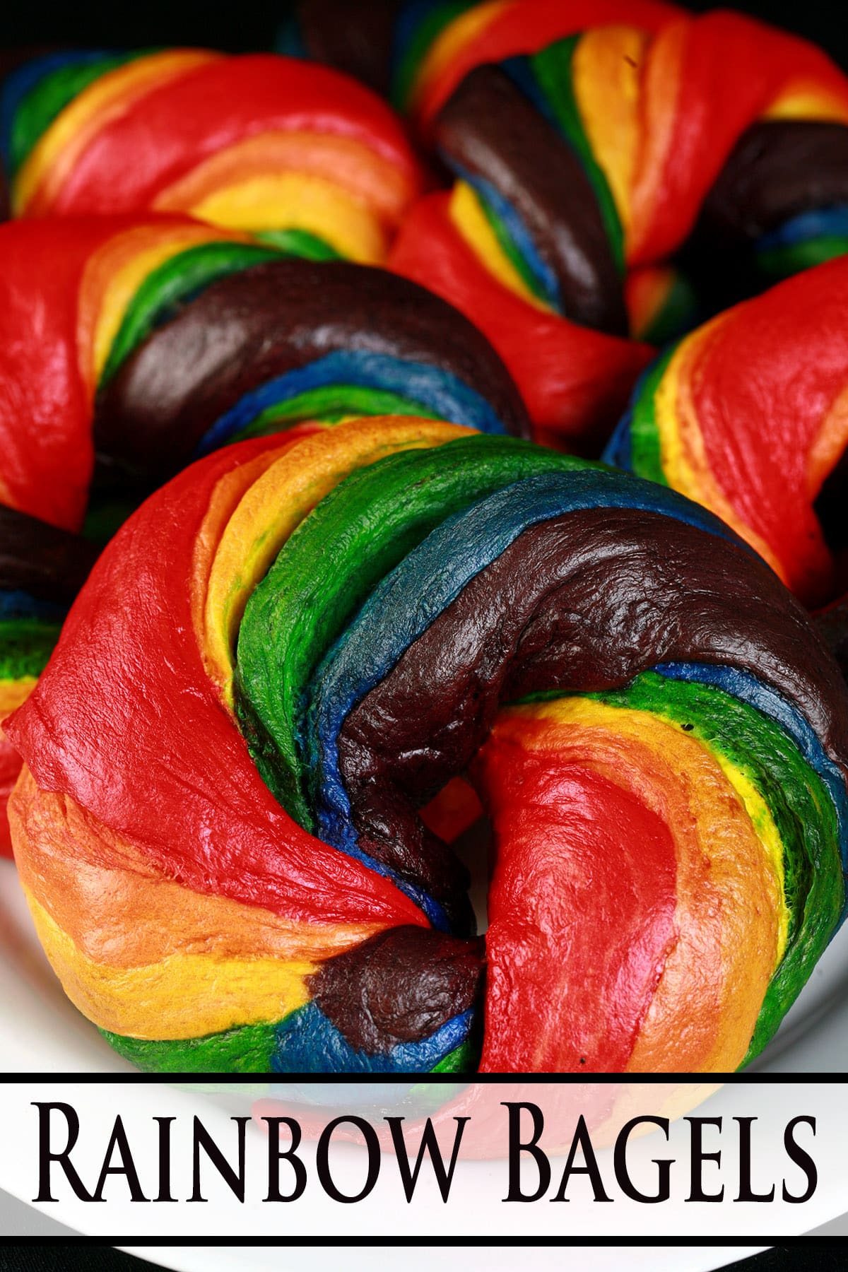 A platter of brightly coloured homemade rainbow bagels.