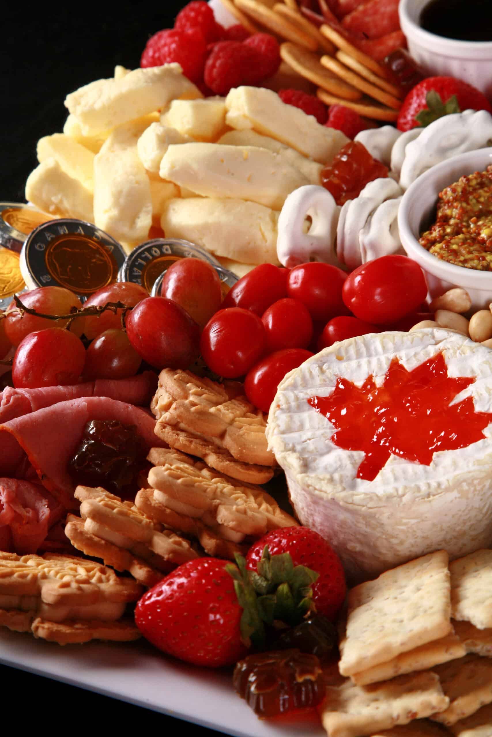 A red and white Canada Day charcuterie board.
