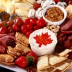 A red and white Canadian themed charcuterie board.