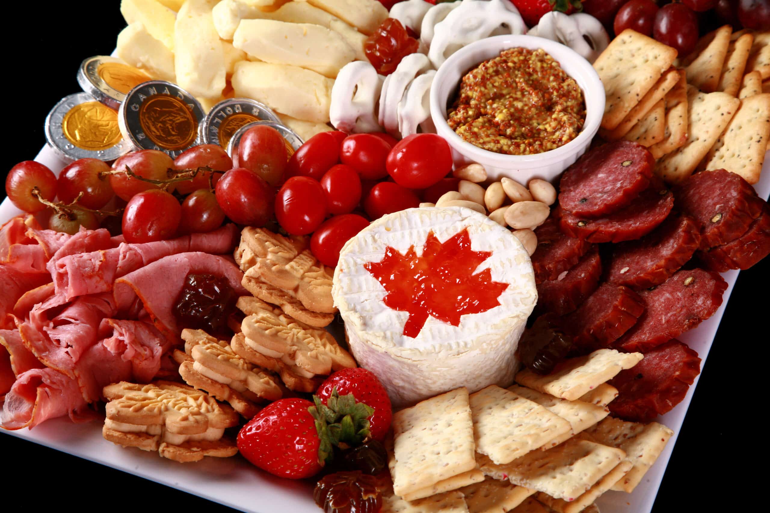A red and white Canadian themed charcuterie board.