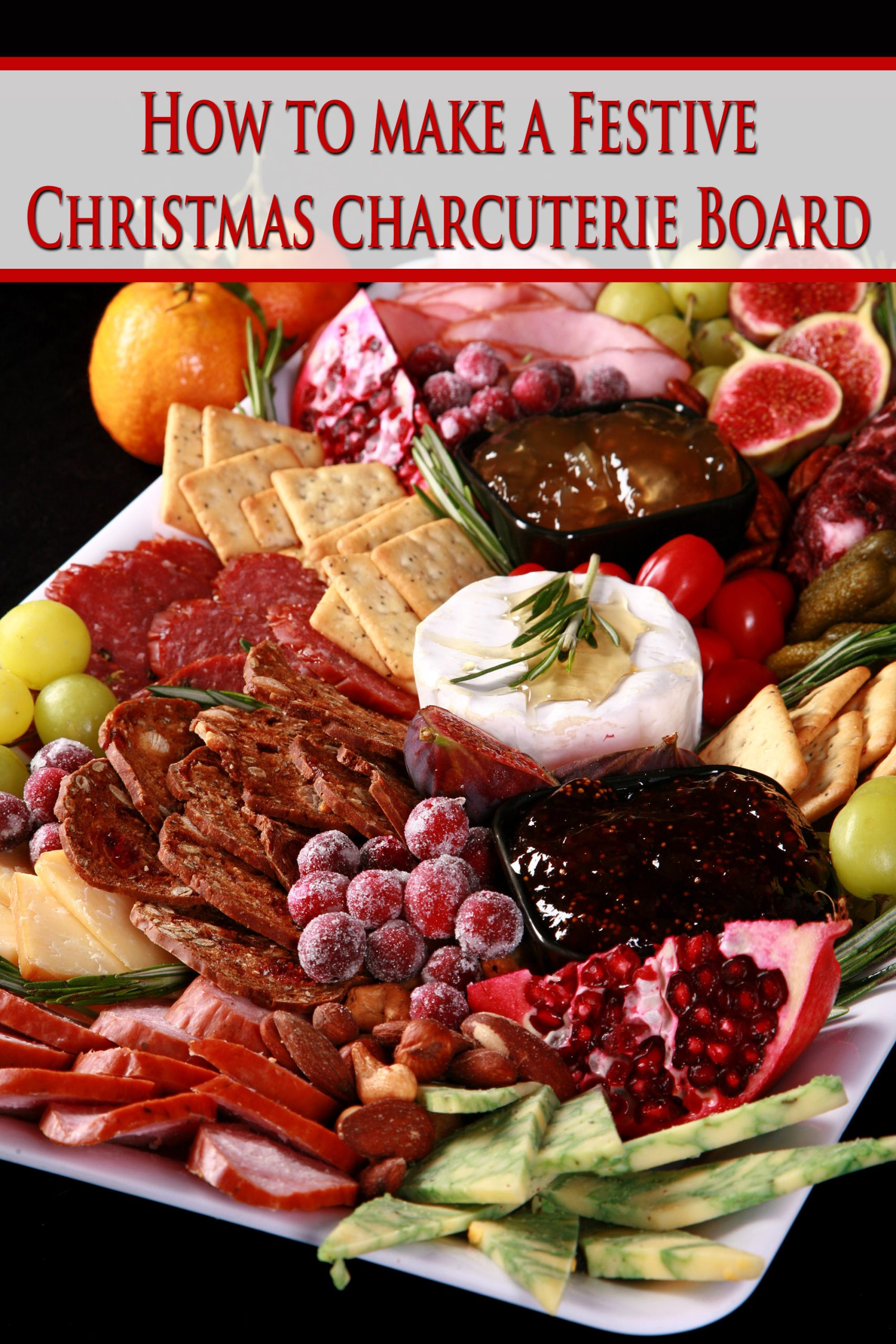 A festive christmas charcuterie board with meats, cheeses, fruit and crackers in a variety of textures and jewel tone colours.