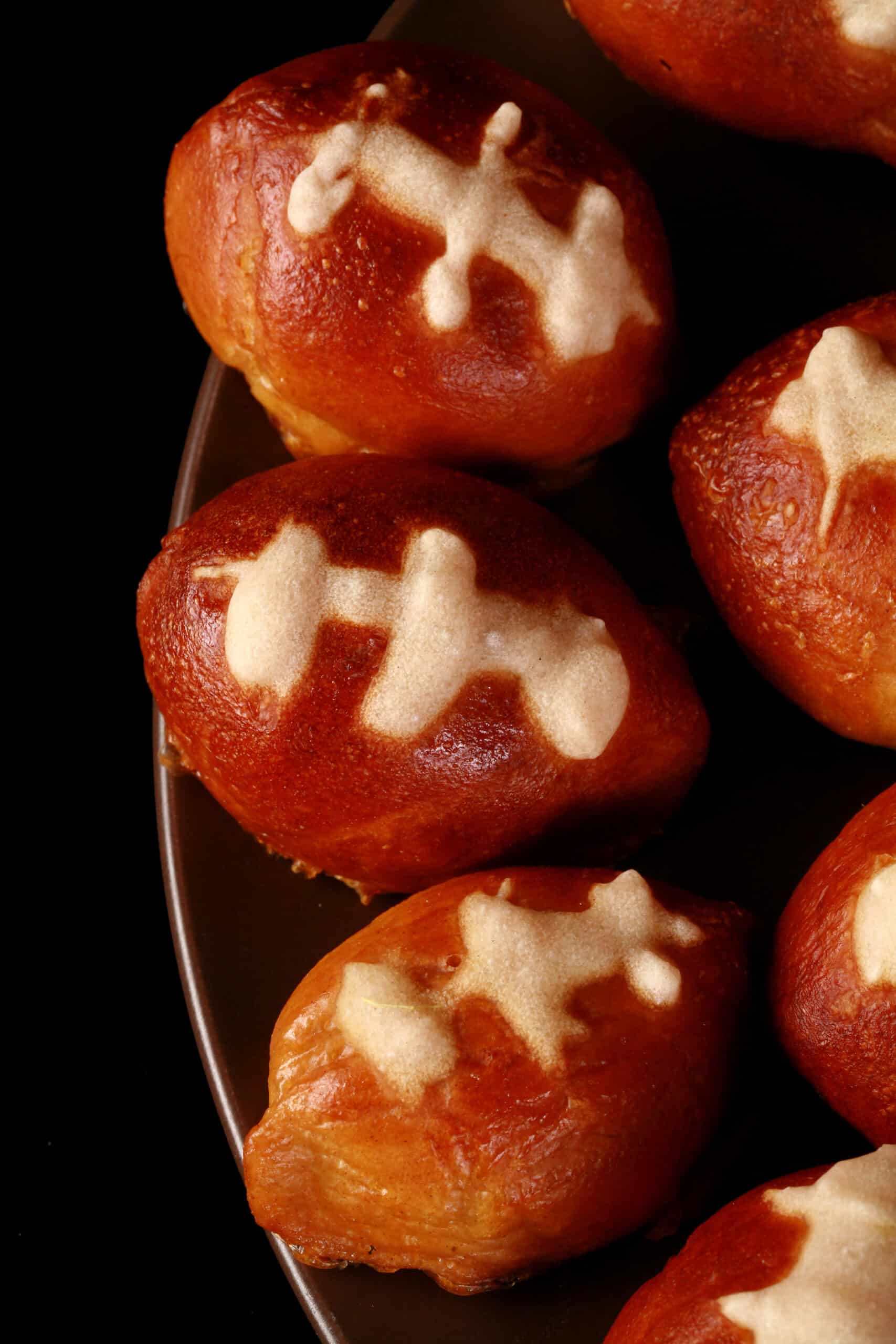 A plate of mini football shaped pretzel bites.