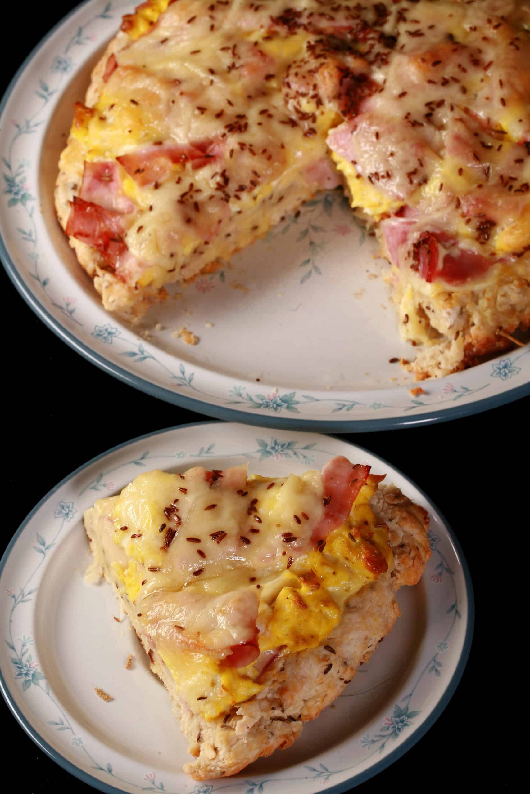 A ham and swiss breakfast pizza on a biscuit crust.