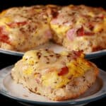 A ham and swiss cheese breakfast pizza on a biscuit crust.