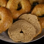 A plate of whole wheat spinach bagels.