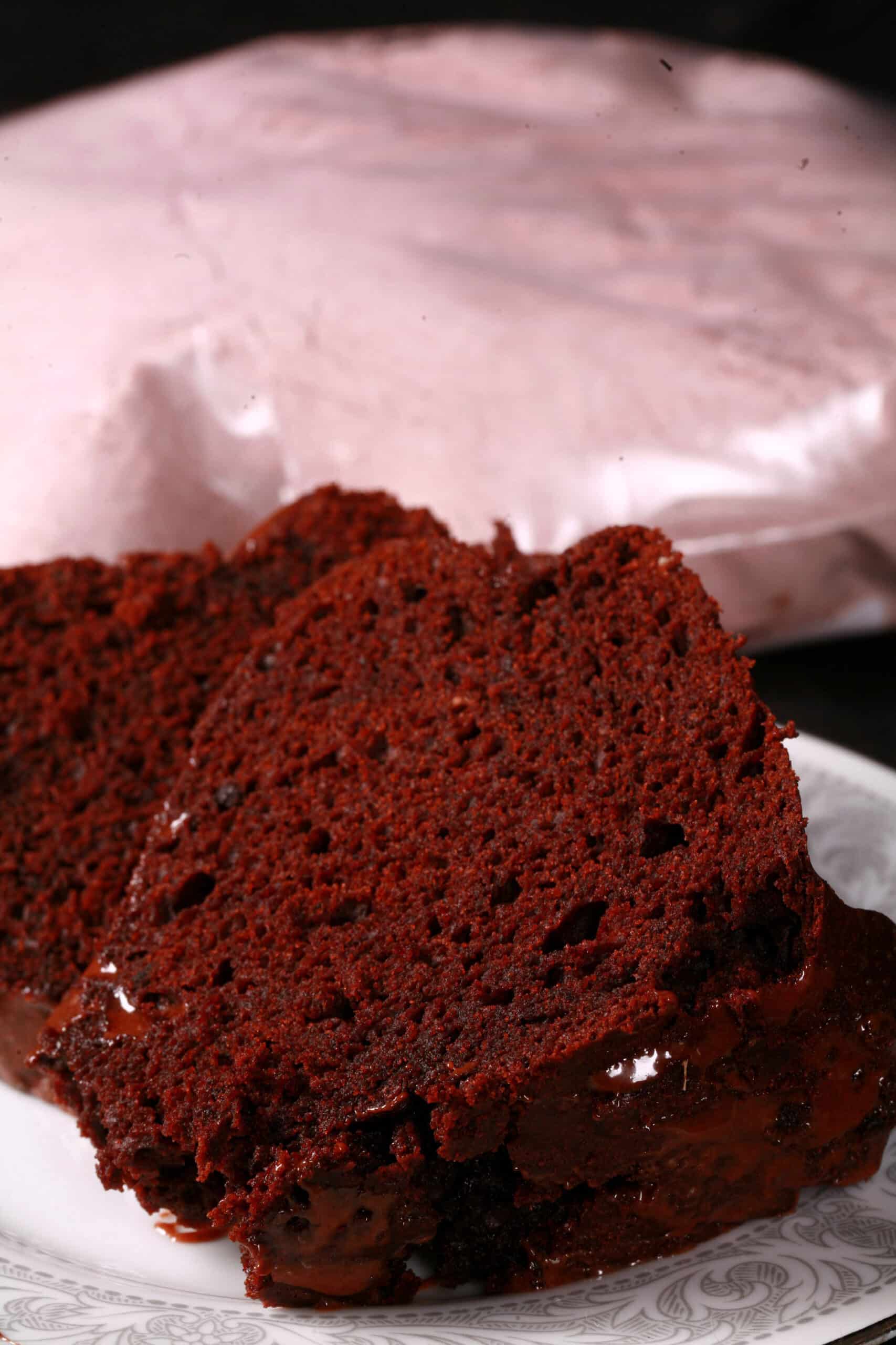 A chocolate bundt cake and a bag of homemade cake mix.