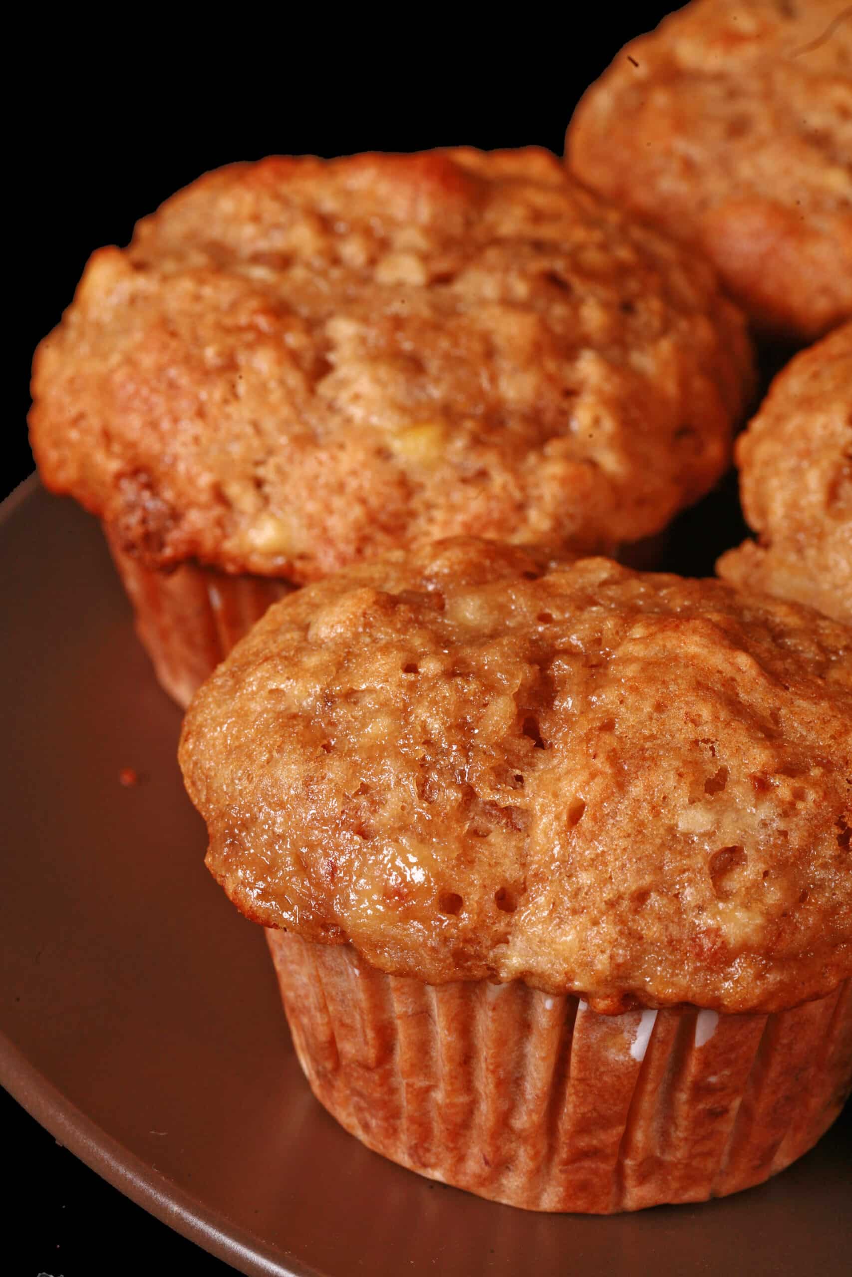 A plate of moist and fluffy eggless banana muffins.