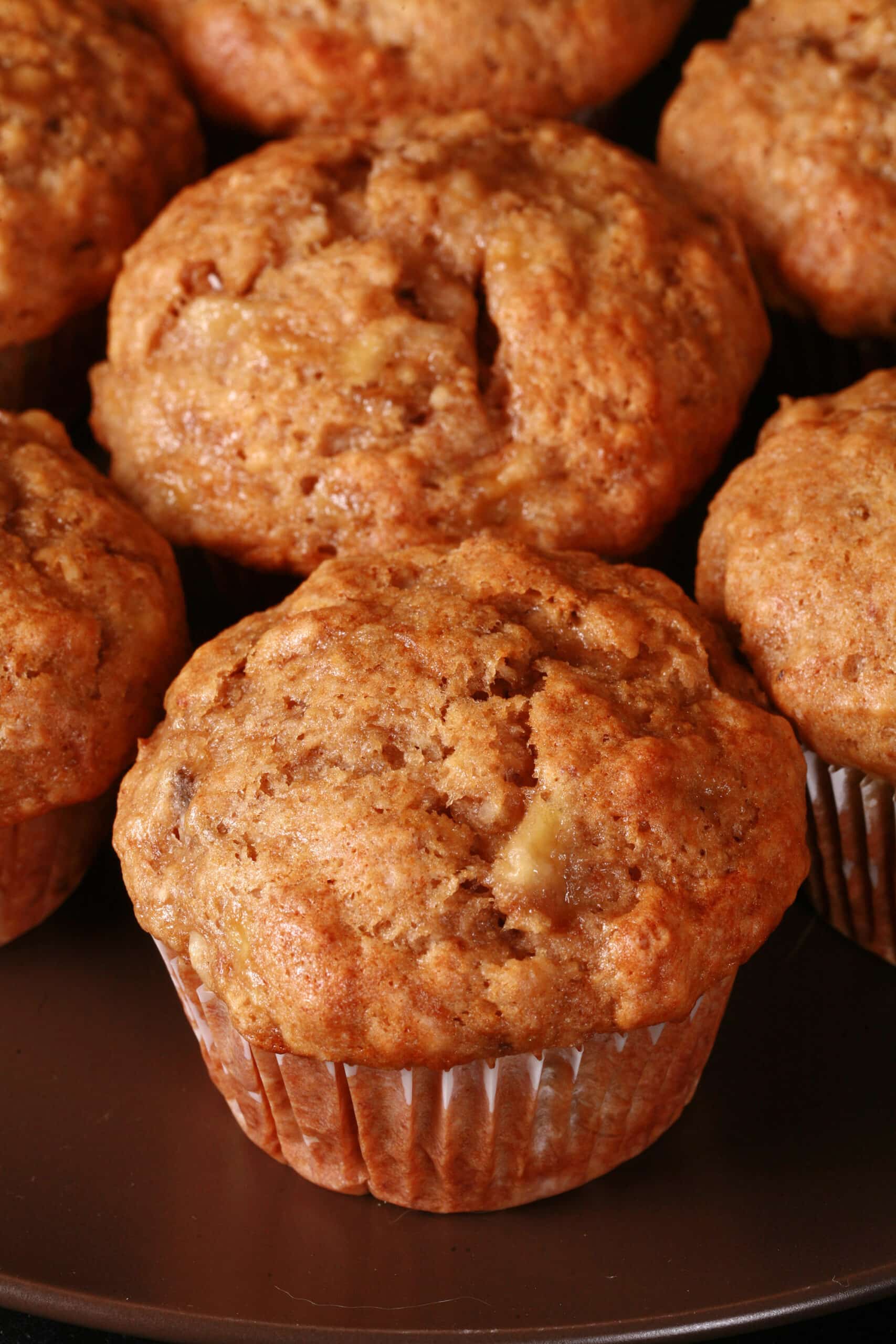 A plate of moist and fluffy eggless banana muffins.