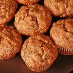 A plate of moist and fluffy egg free banana muffins.