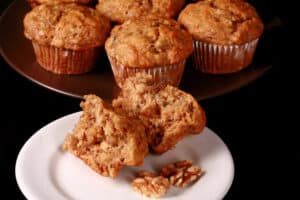 A plate of moist and fluffy eggless banana muffins.