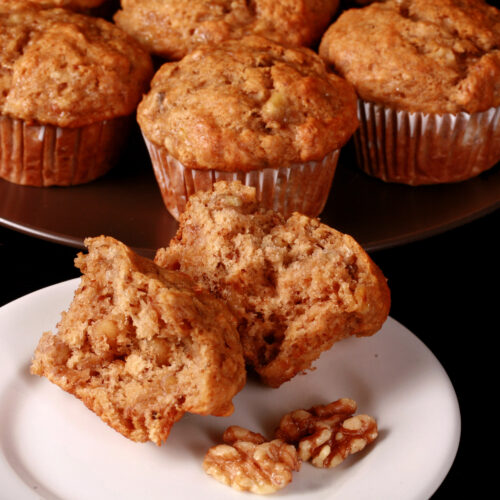 A plate of moist and fluffy eggless banana muffins.