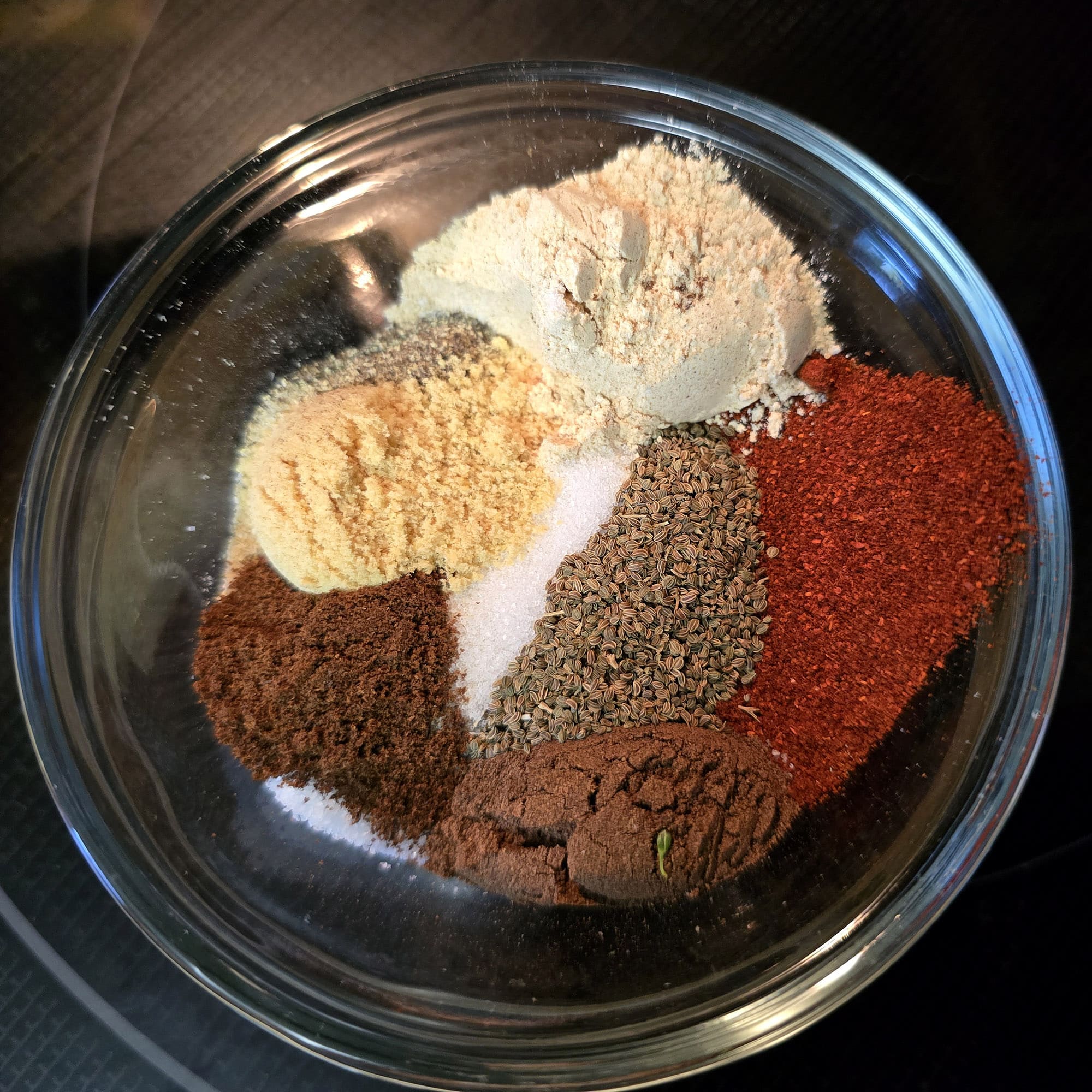 A small glass bowl of spices.