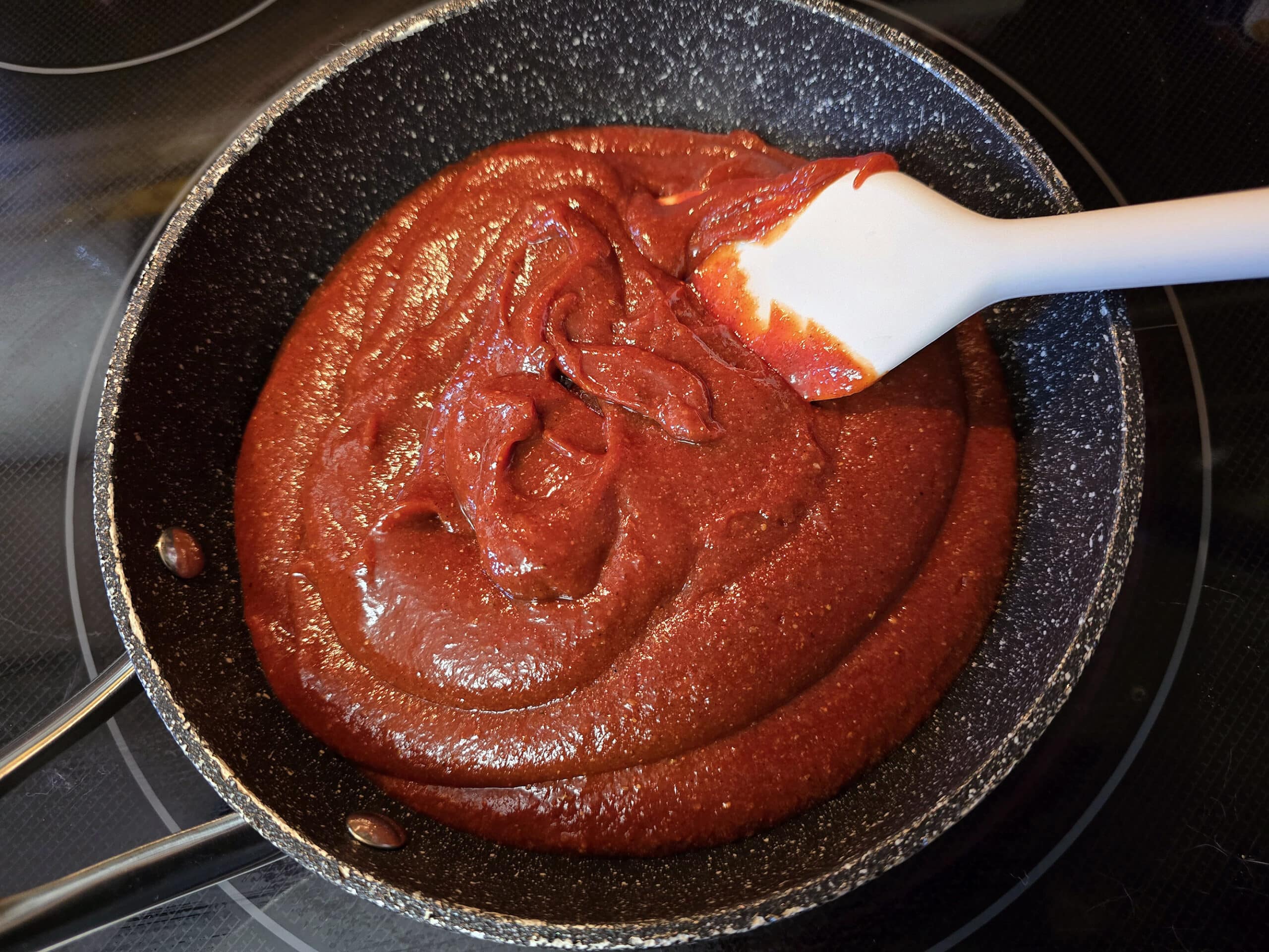 All dressed flavoured ketchup in a small pan.