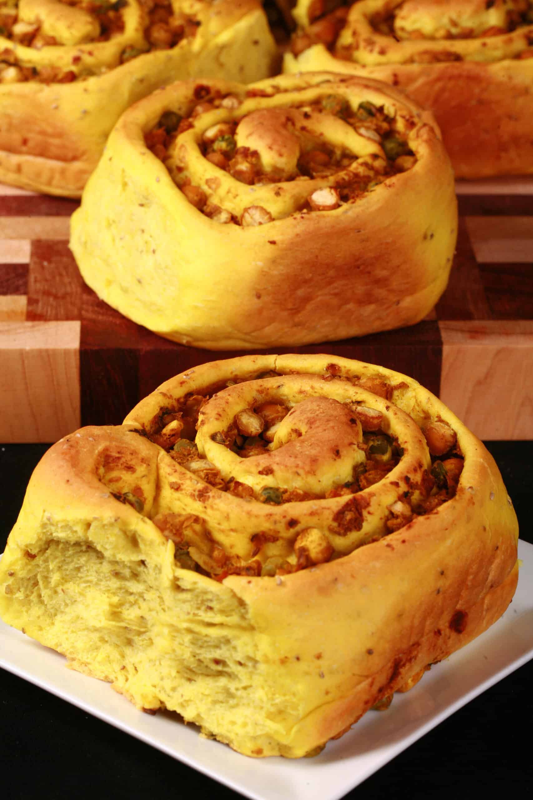 Several Samosa Buns - A spiced dough rolled around a chickpea samosa filling, cinnamon roll style.