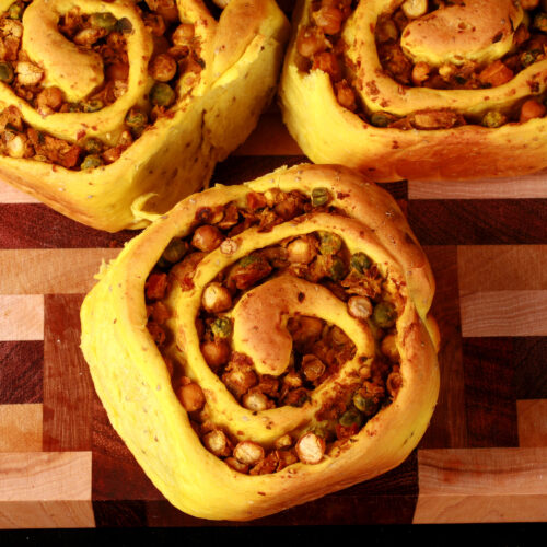 Several Samosa Buns - A spiced dough rolled around a chickpea samosa filling, cinnamon roll style.