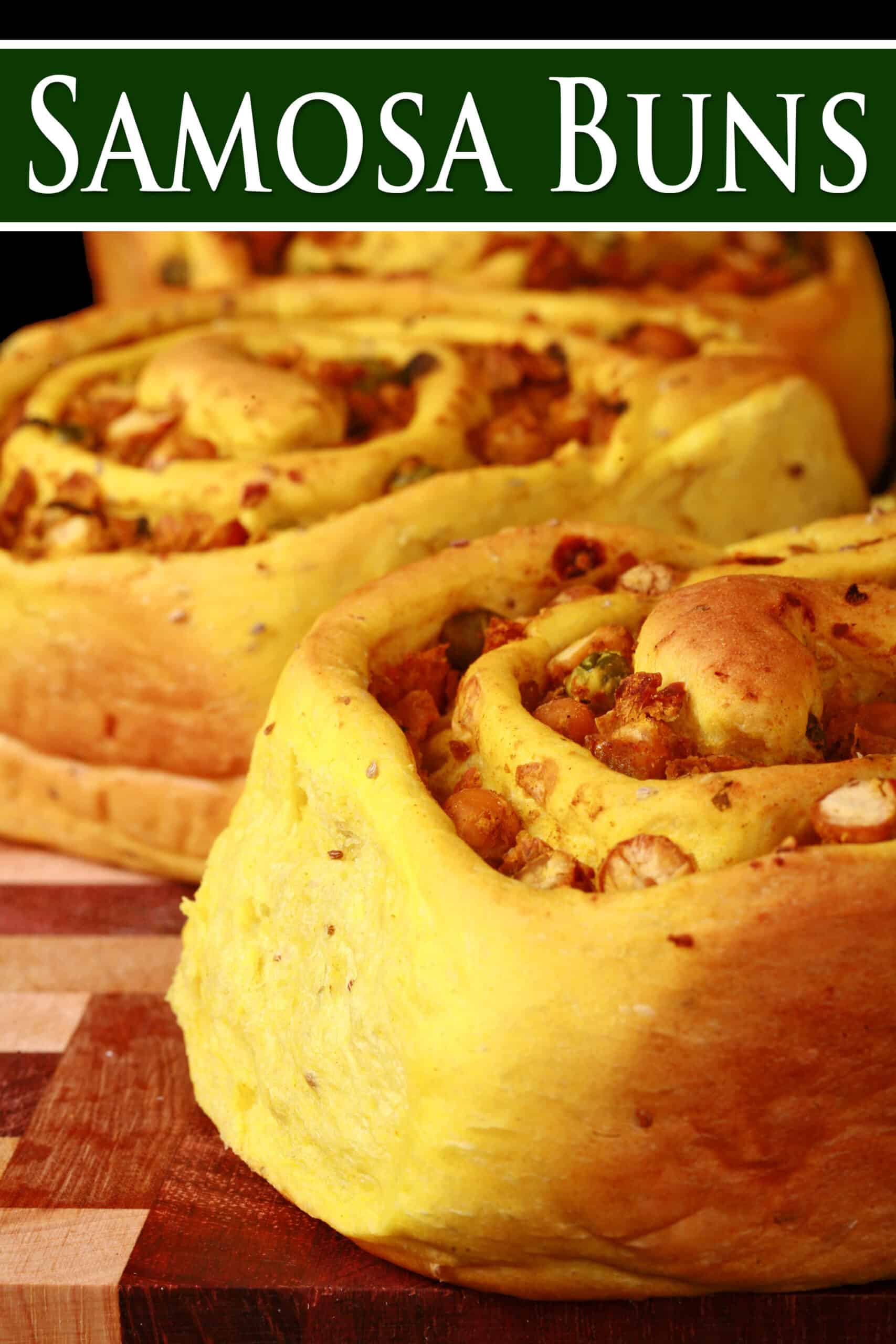 Several Samosa Rolls - A spiced dough rolled around a chickpea samosa filling, cinnamon roll style. Overlaid text says samosa buns.