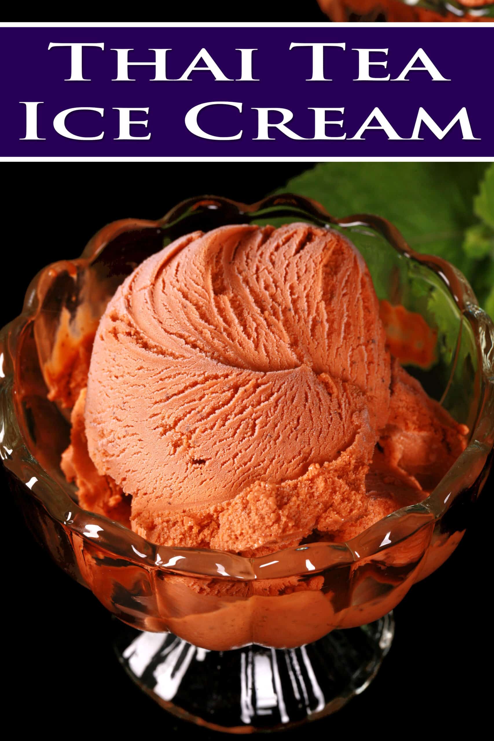 A bowl of Thai iced tea ice cream in a glass bowls, with fresh mint next to it. Overlaid text says Thai tea ice cream.