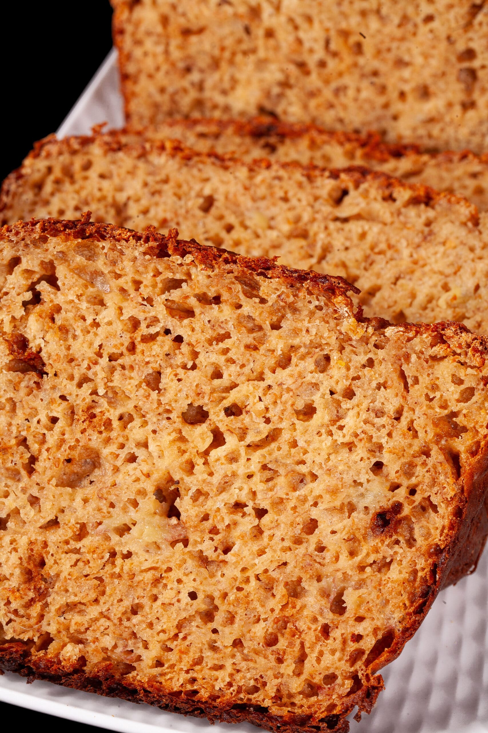 A sliced loaf of high protein banana bread.