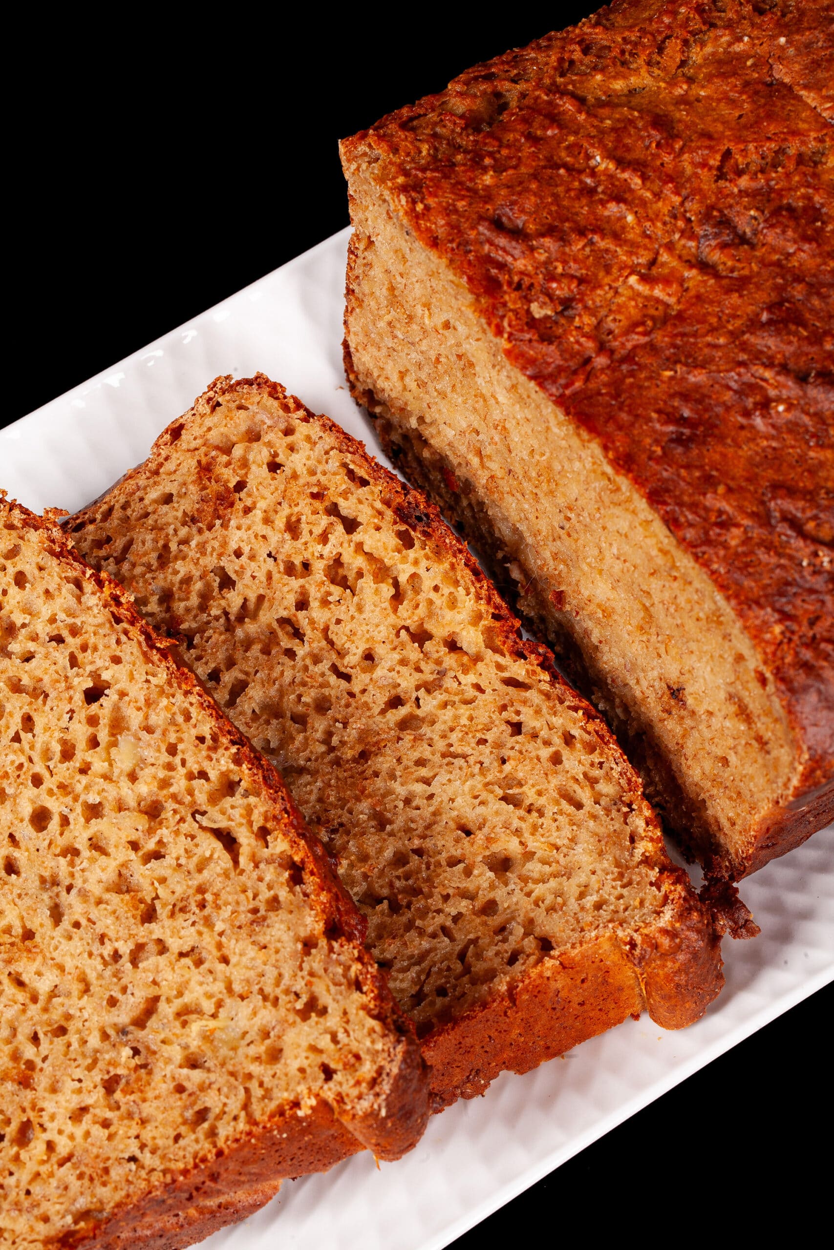 A sliced loaf of protein powder banana bread.