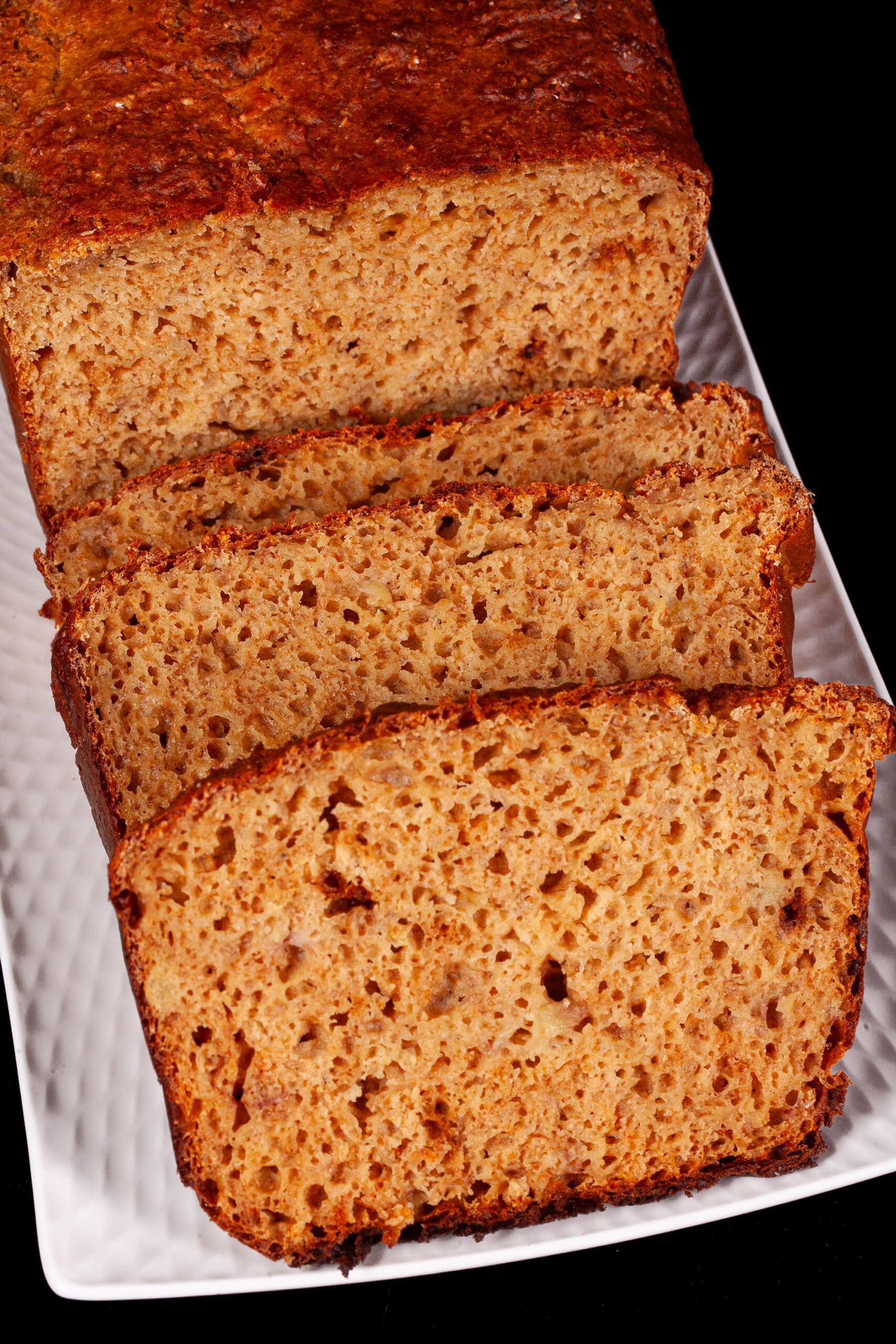 A sliced loaf of protein powder banana bread.