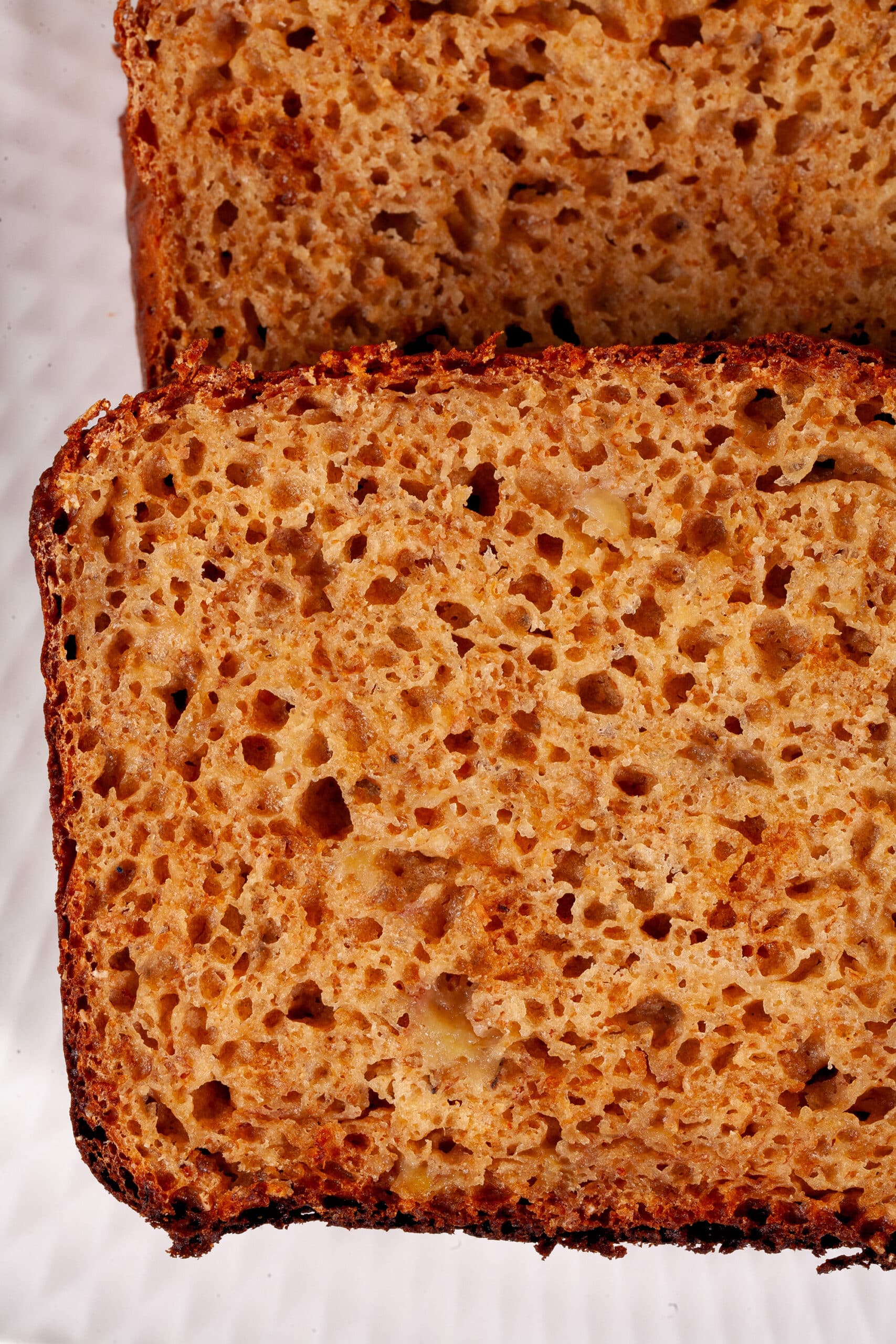 A sliced loaf of high protein banana bread.