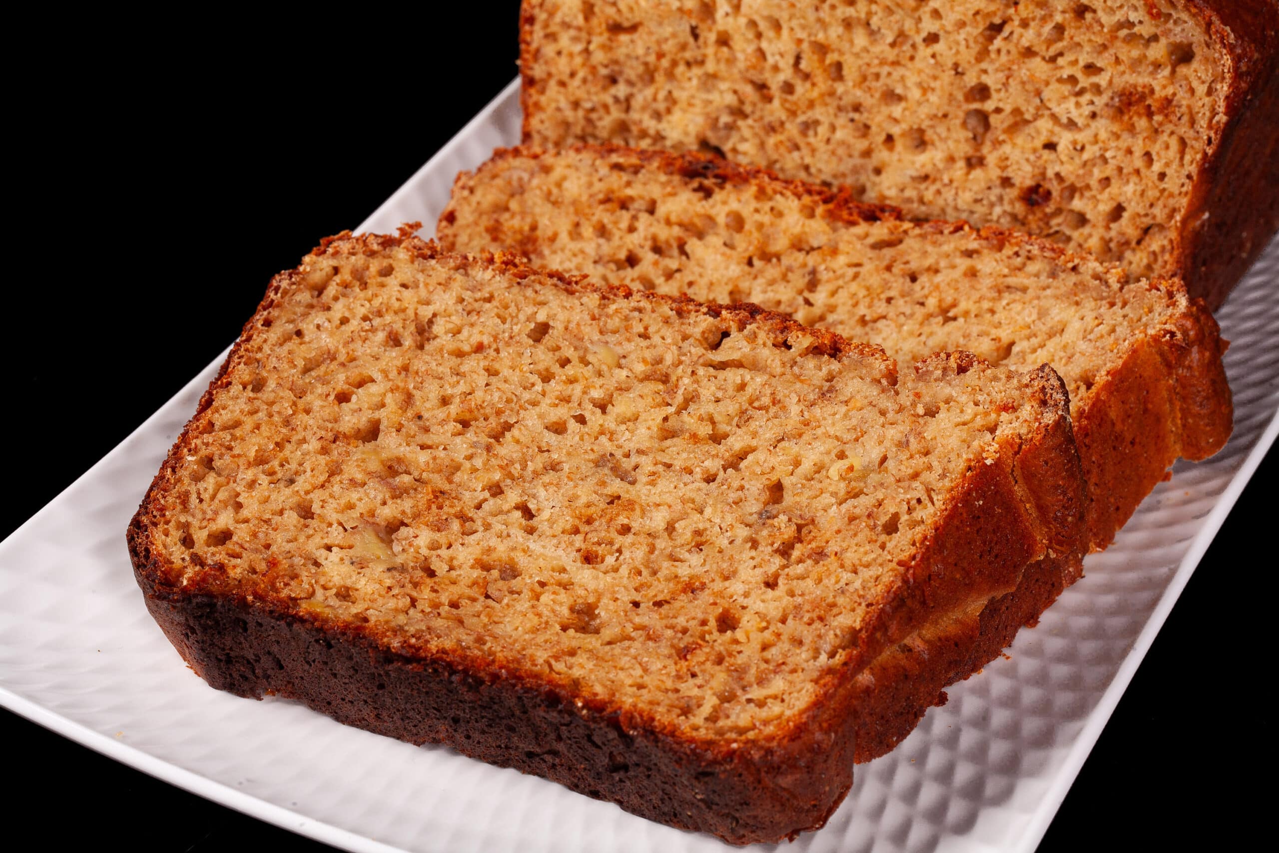 A sliced loaf of protein powder banana bread.