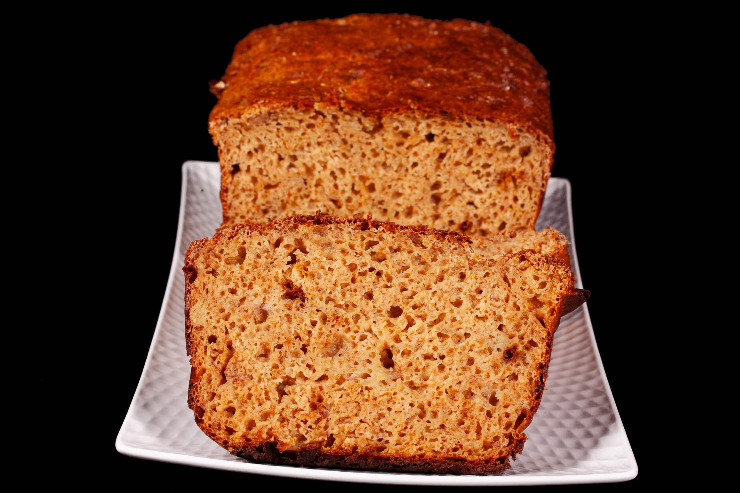 A sliced loaf of high protein banana bread.